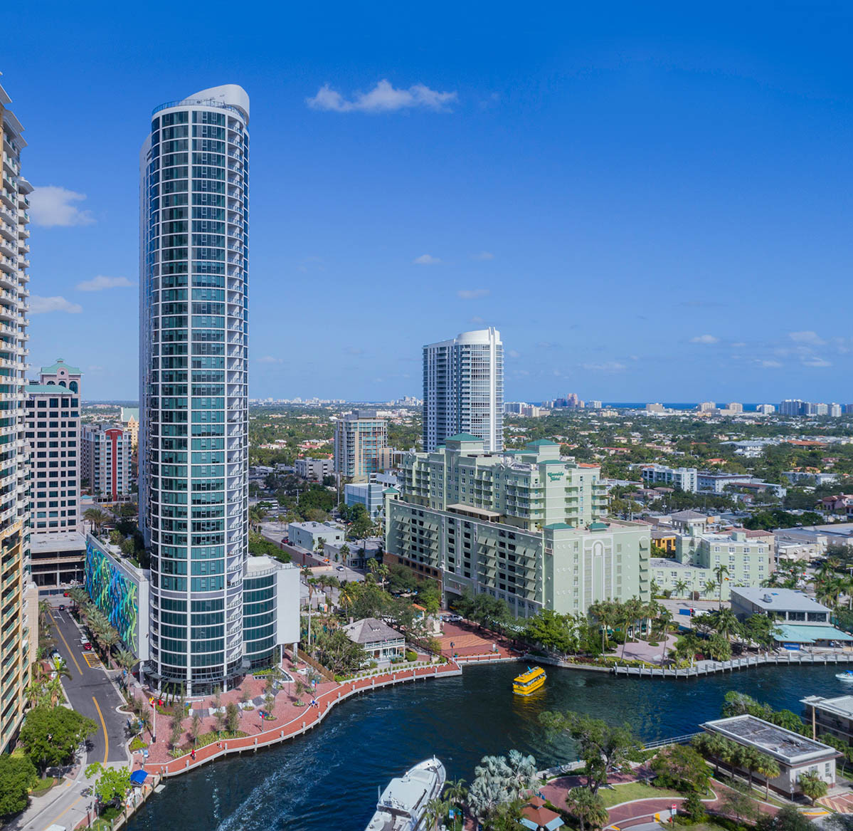 Glass residential high-rises beside a yacht-lined waterway near Las Olas in Fort Lauderdale